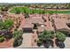 Single-story home with desert landscaping, a 2-car garage, and access to the community's lush golf course at 23225 N Hank Raymond Dr, Sun City West, AZ 85375