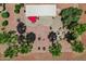 Aerial view of a patio featuring comfortable lounge chairs, a fire pit and desert landscaping at 23225 N Hank Raymond Dr, Sun City West, AZ 85375