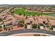 Single-story home with desert landscaping, two-car garage, near the community's lush golf course and pond at 23225 N Hank Raymond Dr, Sun City West, AZ 85375