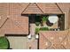 A home featuring a tiled roof, desert landscaping, and a patio with an umbrella for relaxing at 23225 N Hank Raymond Dr, Sun City West, AZ 85375