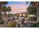 Inviting backyard with a fire pit, ample seating, desert landscaping and golf course views at 23225 N Hank Raymond Dr, Sun City West, AZ 85375