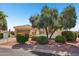 Inviting single-story home with desert landscaping, tile roof and attached two car garage at 23225 N Hank Raymond Dr, Sun City West, AZ 85375