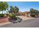 Single-story home with desert landscaping, tile roof and attached two car garage at 23225 N Hank Raymond Dr, Sun City West, AZ 85375