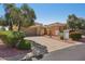 Lovely single-story home with desert landscaping, tile roof and attached two car garage at 23225 N Hank Raymond Dr, Sun City West, AZ 85375