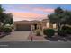 Charming single-story home with well-manicured landscaping and a two-car garage at 23225 N Hank Raymond Dr, Sun City West, AZ 85375
