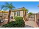 Charming front entrance with mature landscaping, a private patio, and a tiled roof at 23225 N Hank Raymond Dr, Sun City West, AZ 85375