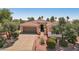 Charming single-story home featuring a well-manicured front yard, desert landscaping and a two car garage at 23225 N Hank Raymond Dr, Sun City West, AZ 85375
