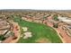 Aerial view of lush golf course and desert landscaping featuring a lake and neighborhood at 23225 N Hank Raymond Dr, Sun City West, AZ 85375