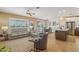Spacious living room with abundant natural light, modern furnishings, and an open floor plan at 23225 N Hank Raymond Dr, Sun City West, AZ 85375