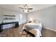 Bedroom featuring dark wood floors, a ceiling fan, and a modern desk at 2333 E Southern Ave # 1049, Tempe, AZ 85282