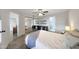 Bright bedroom featuring light wood floors, a ceiling fan, and a stylish mirrored closet at 2333 E Southern Ave # 1049, Tempe, AZ 85282