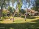 Well-maintained community landscaping featuring grass and mature trees and walkways at 2333 E Southern Ave # 1049, Tempe, AZ 85282