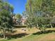 Scenic community with mature trees, landscaping, green grass and outdoor picnic benches at 2333 E Southern Ave # 1049, Tempe, AZ 85282