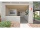 Inviting condo front entrance with textured walls, black trimmed windows, and covered patio at 2333 E Southern Ave # 1049, Tempe, AZ 85282