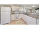Bright kitchen with white cabinets, granite countertops, and modern appliances at 2333 E Southern Ave # 1049, Tempe, AZ 85282