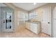 Cozy kitchen featuring white cabinets, granite countertops, and tile flooring at 2333 E Southern Ave # 1049, Tempe, AZ 85282