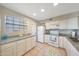 Bright kitchen features granite countertops, white cabinets, and appliances at 2333 E Southern Ave # 1049, Tempe, AZ 85282