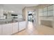 Kitchen area featuring granite countertops, white cabinets, and a stainless steel sink at 2333 E Southern Ave # 1049, Tempe, AZ 85282