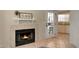 Living room featuring a tiled fireplace and an exterior door leading to the condo's outdoor space at 2333 E Southern Ave # 1049, Tempe, AZ 85282
