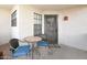Charming condo patio with seating area and a decorative iron gate, offering a cozy outdoor space at 2333 E Southern Ave # 1049, Tempe, AZ 85282