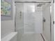 Modern bathroom featuring a sleek glass shower with a rainfall showerhead and white tiling at 2333 E Southern Ave # 1049, Tempe, AZ 85282