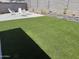 Backyard with artificial lawn and charming landscape at 2364 N 212Th Ave, Buckeye, AZ 85396