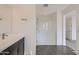 Bright bathroom features a glass shower, vanity sink and tile floors at 2364 N 212Th Ave, Buckeye, AZ 85396