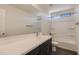 Bathroom features a vanity sink and shower/tub combo with modern finishes at 2364 N 212Th Ave, Buckeye, AZ 85396