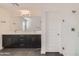 Modern bathroom with dual sink vanity, shower, and white door at 2364 N 212Th Ave, Buckeye, AZ 85396