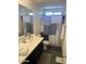 Bathroom features a vanity sink and shower/tub combo with modern finishes at 2364 N 212Th Ave, Buckeye, AZ 85396
