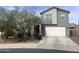 Two-story home featuring a two-car garage and low maintenance landscaping at 2364 N 212Th Ave, Buckeye, AZ 85396