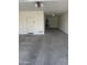 Spacious garage with a white door, concrete floor, and utility connections at 2364 N 212Th Ave, Buckeye, AZ 85396