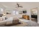 Staged bedroom featuring a ceiling fan, carpet, and connected bathroom at 2364 N 212Th Ave, Buckeye, AZ 85396