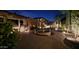 Private backyard with lush plants, brick patio, and water feature create a tranquil outdoor space at 2413 W Kachina Trl, Phoenix, AZ 85041