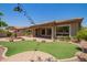 This backyard has a large outdoor area with a water fountain and green grass at 2413 W Kachina Trl, Phoenix, AZ 85041