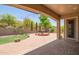 This backyard has a large outdoor area with a water fountain and green grass at 2413 W Kachina Trl, Phoenix, AZ 85041