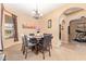 Inviting dining area with chandelier lighting and a view of additional rooms, creating a spacious and open ambiance at 2413 W Kachina Trl, Phoenix, AZ 85041