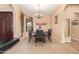 Dining room features a chandelier, neutral paint and window to bring in the natural light at 2413 W Kachina Trl, Phoenix, AZ 85041