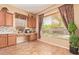 Bright breakfast nook with a window and cabinets, offering a cozy dining area with natural lighting at 2413 W Kachina Trl, Phoenix, AZ 85041