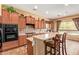Spacious kitchen features a breakfast bar, modern appliances, beautiful countertops, and lots of cabinet space at 2413 W Kachina Trl, Phoenix, AZ 85041