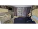 Bright bedroom with white furniture, and colorful patterned curtains at 25 S 102Nd St # 92, Mesa, AZ 85208