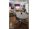 Inviting living room featuring warm wood floors, seating and a round dining table at 25 S 102Nd St # 92, Mesa, AZ 85208