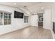 Bright bedroom with wood floors, multiple windows, and a barn door to the en-suite bathroom at 2636 S Bahama Dr, Gilbert, AZ 85295