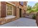 Charming exterior view of a stone clad two-story house with brown accents and well maintained landscaping at 2636 S Bahama Dr, Gilbert, AZ 85295