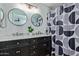 Modern bathroom with dual sinks, marble countertops, and decorative mirrors at 2893 W Five Mile Peak Rd, San Tan Valley, AZ 85144