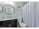 Stylish bathroom featuring modern fixtures, a vanity with a sink, and a decorative shower curtain at 2893 W Five Mile Peak Rd, San Tan Valley, AZ 85144