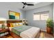 Cozy bedroom with warm lighting, a comfortable bed, and stylish decor at 2893 W Five Mile Peak Rd, San Tan Valley, AZ 85144