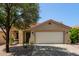 Charming single-story home with a well-maintained front yard and a two-car garage at 2893 W Five Mile Peak Rd, San Tan Valley, AZ 85144