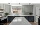 Beautiful kitchen with granite countertops, stainless steel appliances, and two-tone cabinets at 2893 W Five Mile Peak Rd, San Tan Valley, AZ 85144