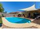 Beautiful backyard pool with shaded pergola, offering a perfect outdoor relaxation and entertainment space at 2893 W Five Mile Peak Rd, San Tan Valley, AZ 85144